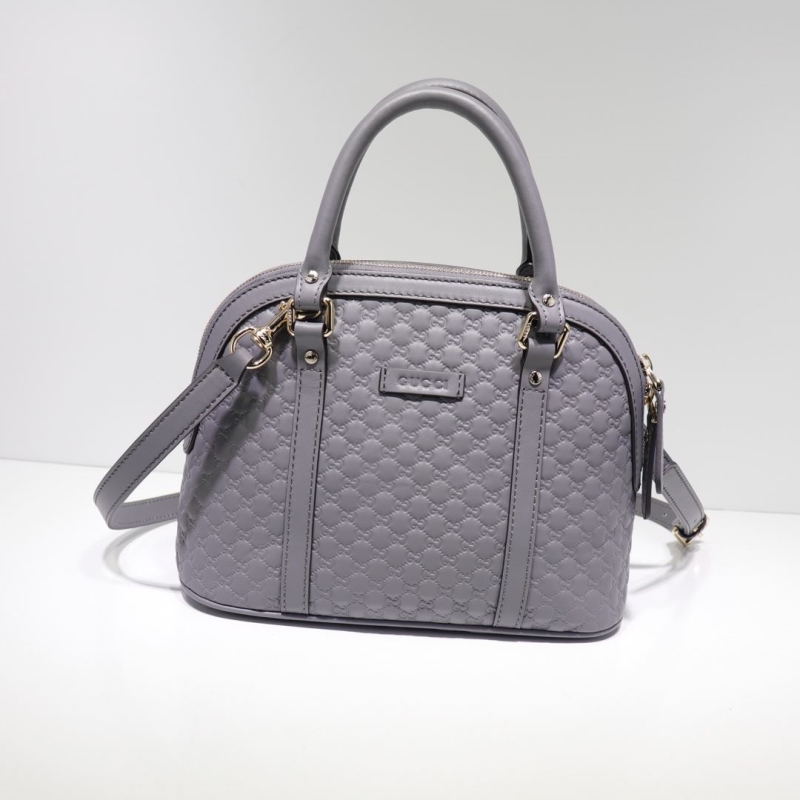 G*u*i top handle bags